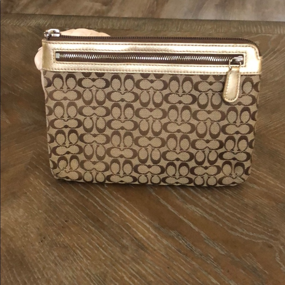 Medium size Coach bag tan in color